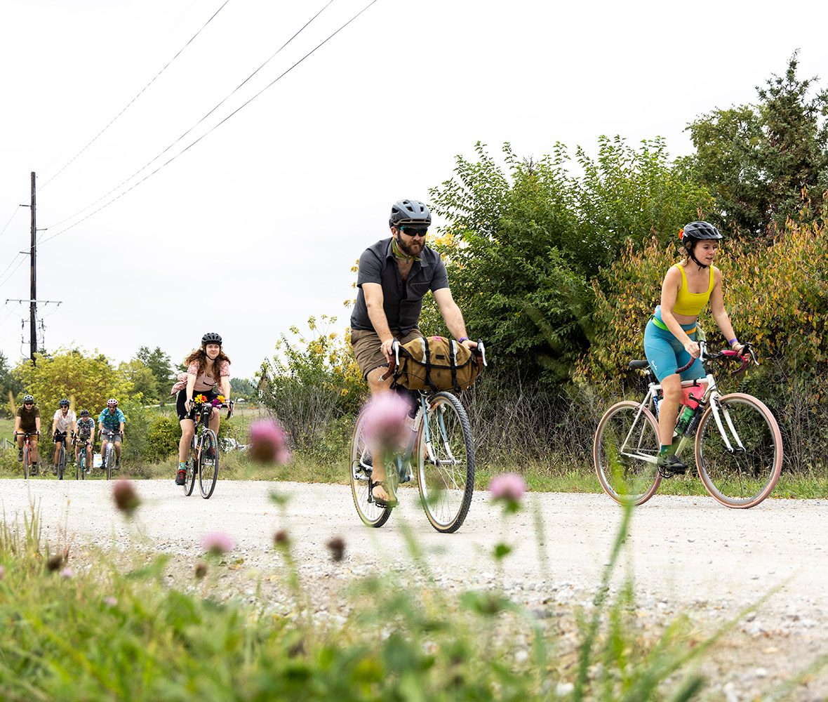 seven bikers ride on a gravel trail in Iowa City