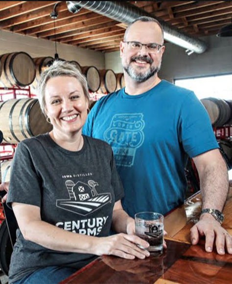 Century Farms Distillery owners sitting at the bar.