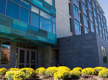 Exterior view of a business with floral landscaping.
