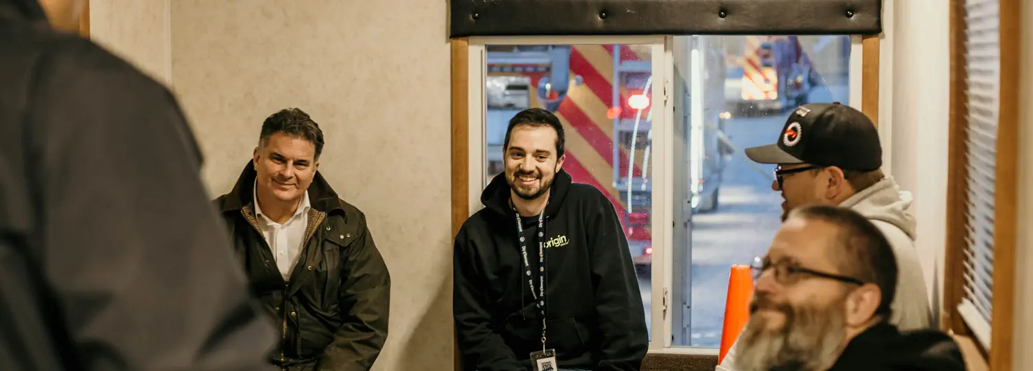 Group of men overlooking a construction project.