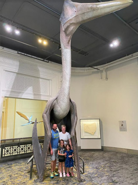 Wells family standing in a museum.