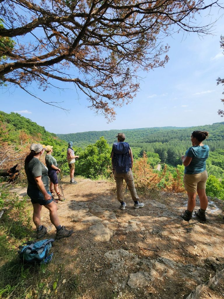 Group of women overlooking a natural setting in Iowa.