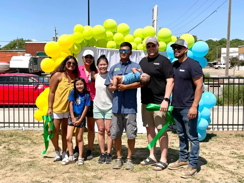The Keoasa Family outside at the ribbon cutting of Yummi Box restaurant.