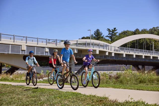 family of four biking in Iowa City